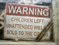 warning children left unattended will be sold to the circus.