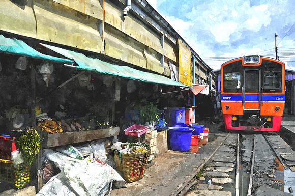 train entering mae klong market thailand